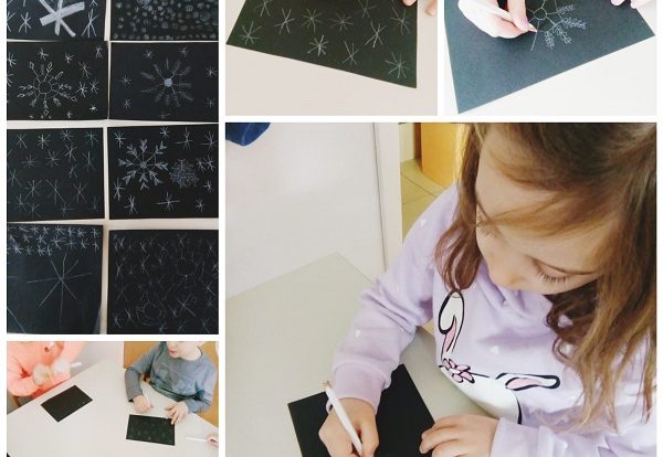 Ribice - fine arts; drawing snowflakes using white color on black paper